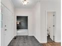 Inviting foyer with grey tile flooring and white trim throughout at 2350 Shore View Nw Way, Suwanee, GA 30024