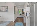Inviting entryway featuring hardwood floors, decorative molding, and stylish decor at 2447 Cadenza Cir, Dacula, GA 30019