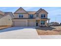 Charming brick home with a three-car garage and well-maintained landscaping, a picture of suburban comfort at 2447 Cadenza Cir, Dacula, GA 30019