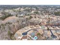 Expansive aerial view showcases the neighborhood's winding streets, mature trees, and well-maintained homesites at 2994 Ash Grove Sw Dr, Conyers, GA 30094