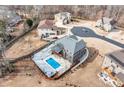 Aerial view of a beautiful home featuring a private backyard oasis with a sparkling swimming pool at 2994 Ash Grove Sw Dr, Conyers, GA 30094