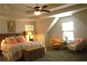 Inviting primary bedroom showcasing neutral tones, complemented by soft furnishings and a serene ambiance at 1231 St James Pl, Loganville, GA 30052