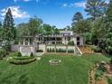 Expansive backyard showcasing a pool, manicured lawn, and elegant landscaping at 3625 Tuxedo Nw Rd, Atlanta, GA 30305