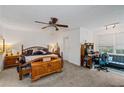 Spacious main bedroom with a ceiling fan and neutral decor at 410 Lima Ct, Woodstock, GA 30188