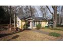 Charming single-story house with stone accents and a cozy, welcoming facade in a wooded neighborhood at 4622 Dogwood Rd, Pine Lake, GA 30072