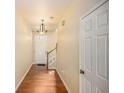 Bright hallway with hardwood floors leading to the main area, next to a staircase at 3364 Thornbridge Dr # 0, Powder Springs, GA 30127
