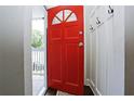 Bright foyer with a red front door and coat hooks, leading into the home's interior at 139 Merritt Se St, Marietta, GA 30060