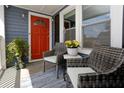 Charming front porch with comfortable seating and a bright red door, creating a welcoming entrance at 139 Merritt Se St, Marietta, GA 30060