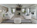 Bright living room with fireplace, modern furniture, and access to outdoor space at 7625 Breeze Bay Rd, Cumming, GA 30041