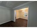 Classic dining room showcasing hardwood floors and a modern chandelier at 767 Vinson Pl, Atlanta, GA 30315