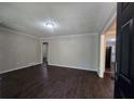 Comfortable living room featuring hardwood floors, neutral walls, and bright windows at 767 Vinson Pl, Atlanta, GA 30315