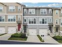 Attractive townhome exteriors showcasing varied color schemes, inviting entryways, and convenient attached garages at , Atlanta, GA 30318