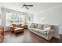 Inviting living room features hardwood floors, neutral paint, and comfortable seating, illuminated by natural light at , Atlanta, GA 30318