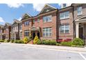 Charming brick townhome with well-kept landscaping and inviting entrance at 1222 Lavista Ne Cir, Atlanta, GA 30324