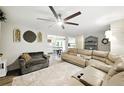 Open-concept living room provides views of the kitchen and dining area, creating an ideal entertaining space at 1430 Mineral Springs Rd, Hoschton, GA 30548