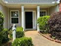 Inviting front entrance with beautiful landscaping, stone walkway and plenty of curb appeal at 19 Windcrest Dr, Covington, GA 30016