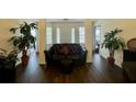 Spacious living room featuring wood floors, neutral walls, and comfortable seating arrangement at 19 Windcrest Dr, Covington, GA 30016