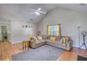 Cozy living room with vaulted ceilings, comfortable seating, and stylish decor, creating a welcoming atmosphere at 2000 Redwood Trce, Ellenwood, GA 30294