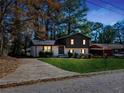 Charming two-story home featuring a well-maintained front yard, fresh landscaping, and a private driveway at 2814 Lloyd Rd, Decatur, GA 30034