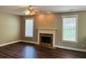 Spacious living room featuring a fireplace, wood floors, and ample natural light at 1714 Boulder Walk Se Ln, Atlanta, GA 30316
