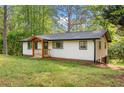 Attractive home boasting a new front porch, level yard, and black framed windows with a partially finished basement at 474 Upper Burris Rd, Canton, GA 30114