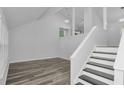 Bright living area with new floors and natural light, leading to the staircase at 6625 Peppermill Ln, South Fulton, GA 30349