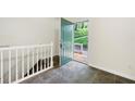 Bright entryway with a ceramic tile floor, staircase, and open door leading to the porch at 3684 Regent Nw Dr, Kennesaw, GA 30144