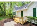 Inviting front porch with decorative railings, perfect for enjoying the outdoors at 3684 Regent Nw Dr, Kennesaw, GA 30144