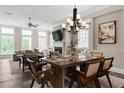 The open dining area boasts modern lighting and flows seamlessly into the living space at 6763 Encore Blvd, Atlanta, GA 30328