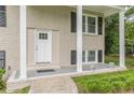 Inviting front porch with white columns, brick facade, and a bright white front door at 5312 Brittany Trl, Atlanta, GA 30349