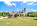Beautiful house with a lush green lawn, elegant landscaping, and a circular driveway at 122 Gingers Way, Mcdonough, GA 30252