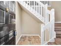 Welcoming entryway featuring a tile floor, stairs, and a stylish front door at 1482 N Crossing Ne Cir, Atlanta, GA 30329