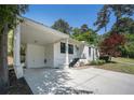 The home features a freshly painted exterior, well-maintained lawn, and a covered carport at 962 Cardova Ne Dr, Atlanta, GA 30324