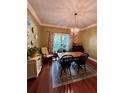 Charming dining room with hardwood floors and a window view at 260 Manning Sw Rd # 42, Marietta, GA 30064