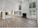 Bright, open living space with high ceilings, fireplace and large windows at 4345 Park Brooke Trce, Alpharetta, GA 30022