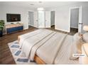 Spacious main bedroom featuring neutral colors, ensuite, and double closets at 4345 Park Brooke Trce, Alpharetta, GA 30022