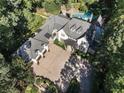 Gorgeous aerial view of home with pristine landscaping, three-car garage, and inviting pool at 4375 Mount Paran Pkwy Nw, Atlanta, GA 30327