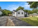 Exterior view of home with a driveway, lawn and a storage shed at 1926 Lakewood Se Ter, Atlanta, GA 30315