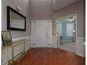 Spacious foyer with hardwood floors, large mirror, and convenient access to an adjacent home office space at 1535 Justine Se Way, Mableton, GA 30126