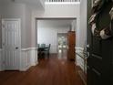 Inviting foyer with hardwood floors, detailed trim, and open view into the dining room and backyard at 1535 Justine Se Way, Mableton, GA 30126