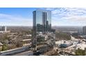 Modern high-rise condominium building with reflective glass windows, offering urban living in a luxurious setting with stunning city views at 3630 Peachtree Rd # 1909, Atlanta, GA 30326