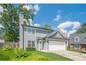 Charming two-story home with a well-manicured lawn, and an attached two-car garage at 2055 Summer View Place Sw, Marietta, GA 30060