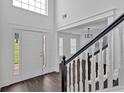 Grand foyer with a staircase, large windows, and modern flooring and an open floor plan at 2586 Abbotts Glen Nw Dr, Acworth, GA 30101