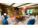 Cozy living room with a brick fireplace, built-in shelves, and comfortable seating at 1110 Blackwell Rd, Marietta, GA 30066