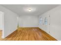 Cozy room features hardwood floors and neutral walls at 2775 Hogan Rd, Atlanta, GA 30344