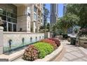 Charming walkway featuring lush flower beds, decorative fountains, and a serene garden setting at 3445 Stratford Rd # 1501, Atlanta, GA 30326