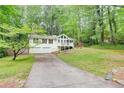 Charming two-story home features a front porch, two-car garage, and a well-maintained lawn at 3861 Hanover Ct, Marietta, GA 30062