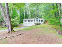 Charming two-story home features a front porch, two-car garage, and a well-maintained lawn at 3861 Hanover Ct, Marietta, GA 30062