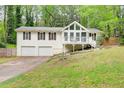 Charming two-story home features a front porch, two-car garage, and a well-maintained lawn at 3861 Hanover Ct, Marietta, GA 30062