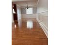 Formal dining room with hardwood floors, new paint, and modern light fixture at 1055 Worthington Hills Dr, Roswell, GA 30076